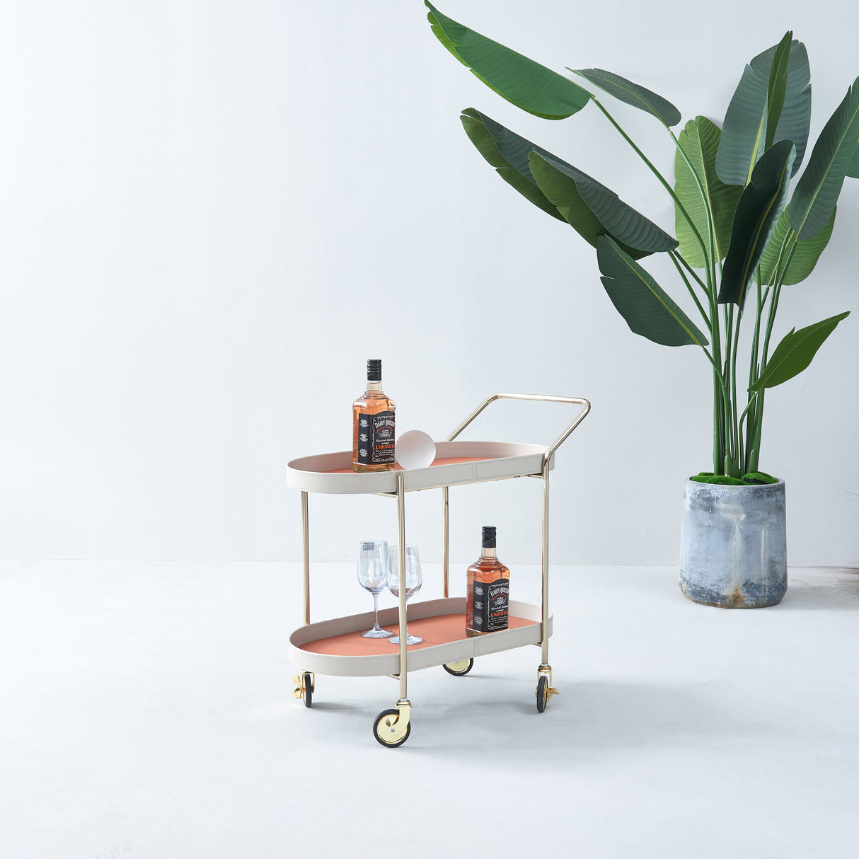Portable Oval Faux Saddle Leather Side Table with a Gold Stainless Steel Frame — Innovative Rolling Dual-Tier Drink Trolley for the Dining Room