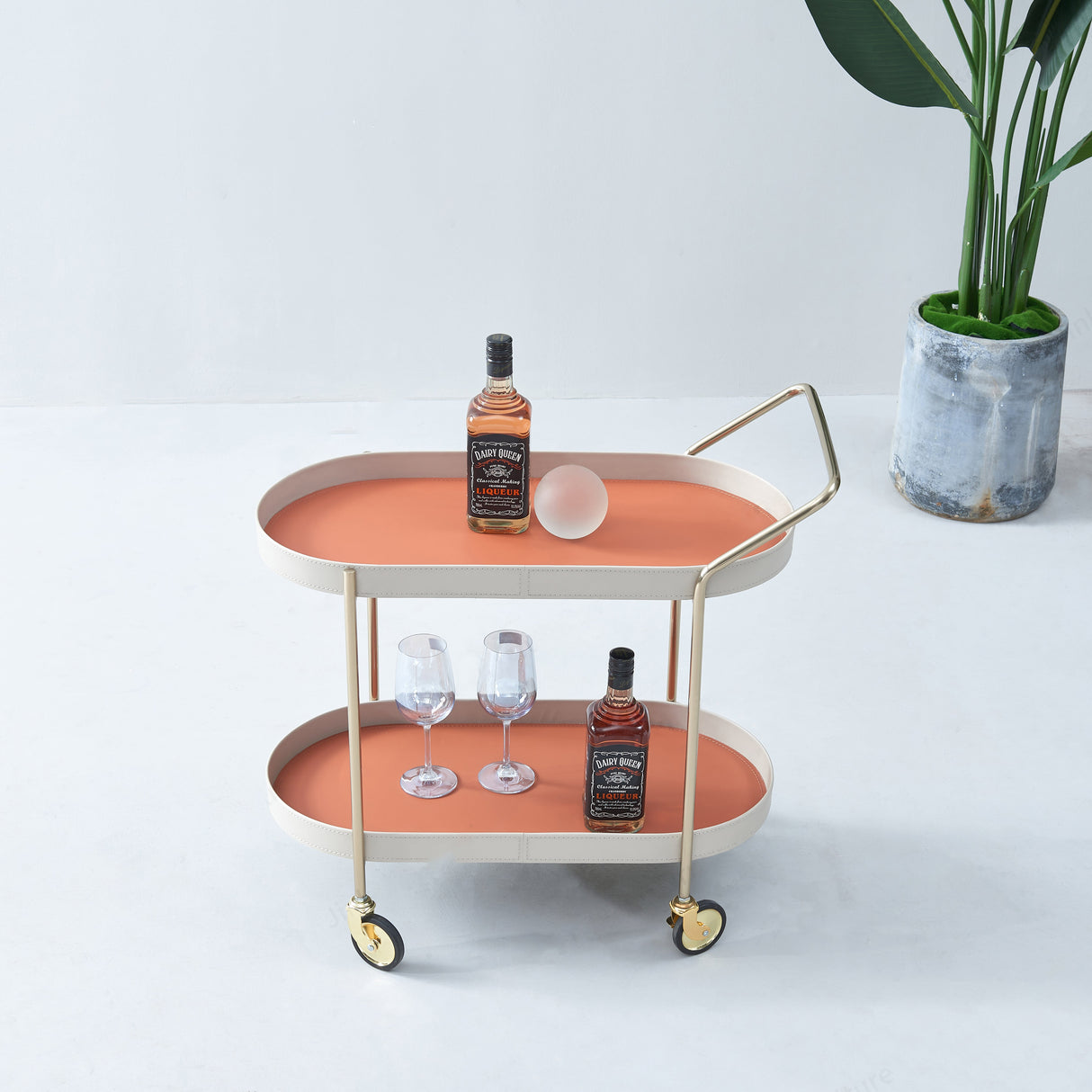 Portable Oval Faux Saddle Leather Side Table with a Gold Stainless Steel Frame — Innovative Rolling Dual-Tier Drink Trolley for the Dining Room