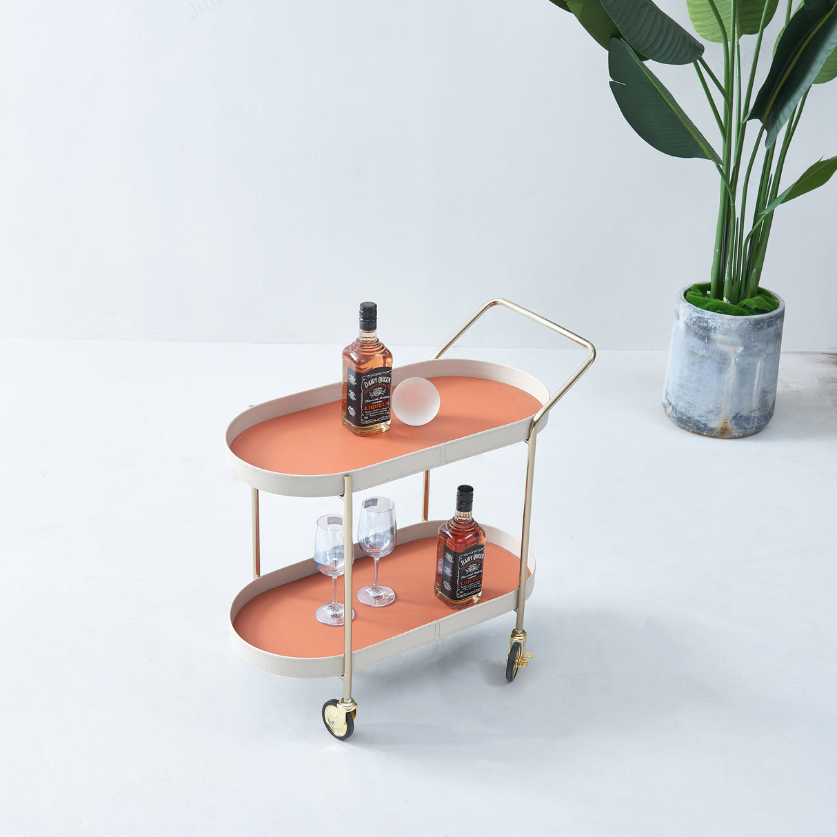 Portable Oval Faux Saddle Leather Side Table with a Gold Stainless Steel Frame — Innovative Rolling Dual-Tier Drink Trolley for the Dining Room
